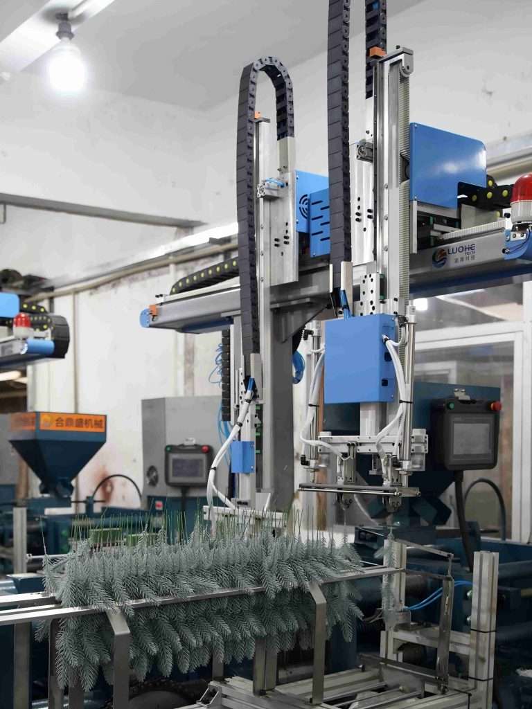Automated artificial Christmas tree production line with branch binding and PE injection machines, running efficiently in a Runyi Crafts factory, reducing labor costs in 2026.