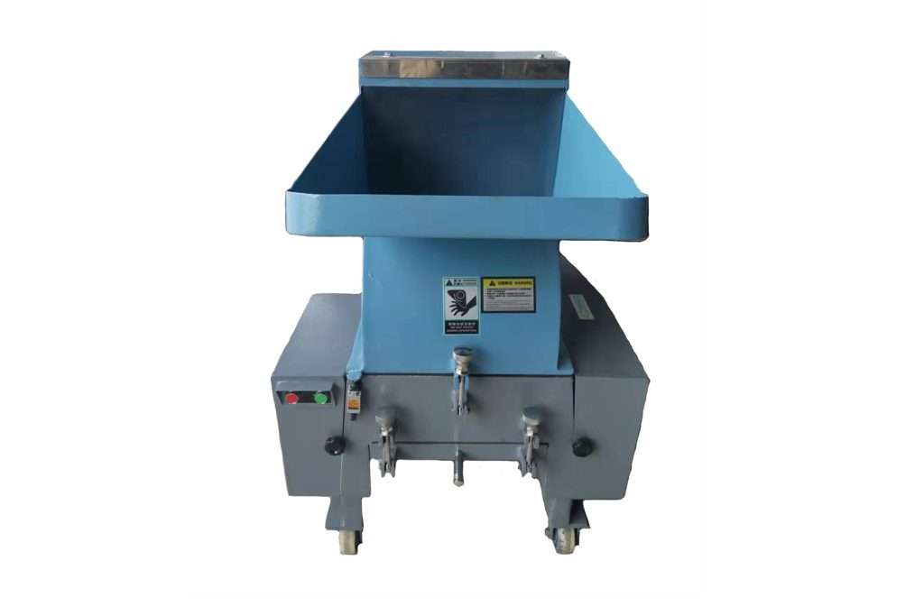 Crushing machine for processing plastic waste from Christmas tree manufacturing.